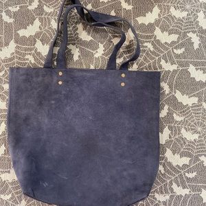 Lovely dark blue suede tote bag with gold hardware!